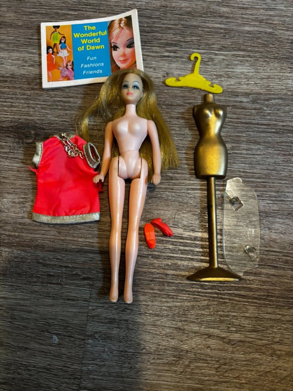 Topper Dawn Fancy Feet doll wearing orange and silver straight hard legs